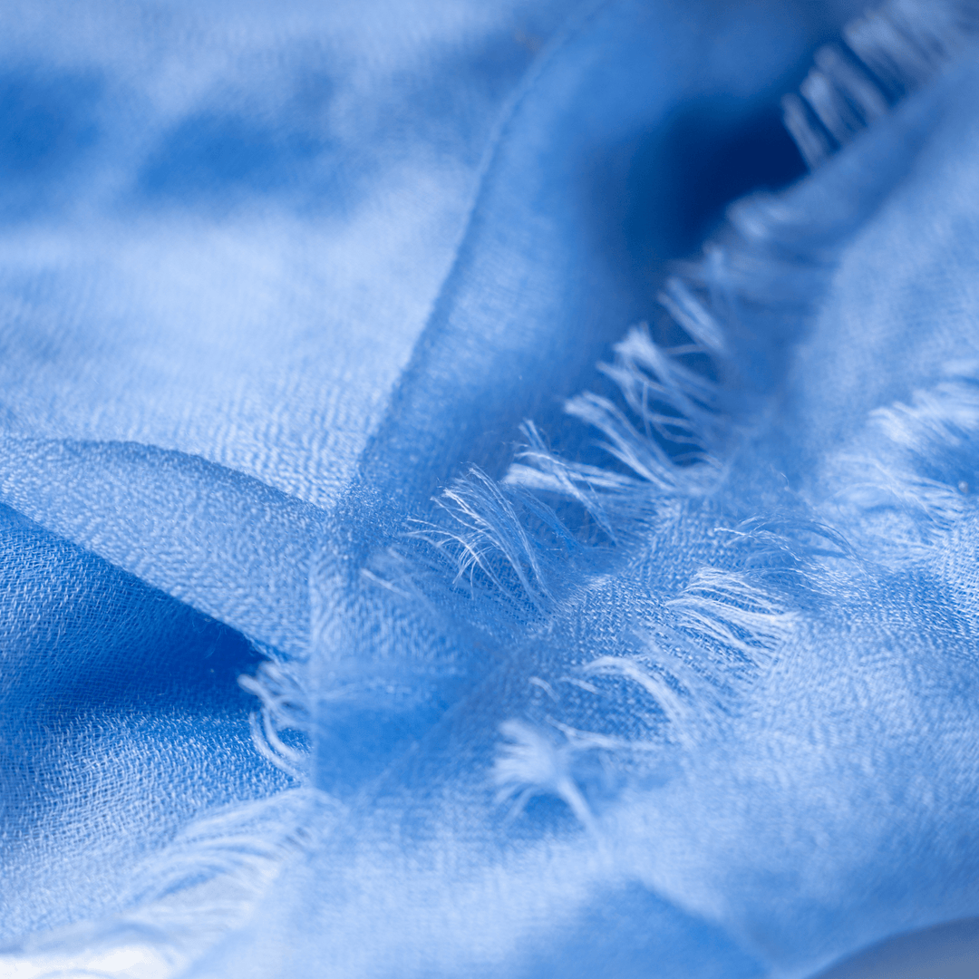 Close-up of fluffy raw edge Bel Air Blue 100% Cashmere Ring Scarf#color_bel-air-blue